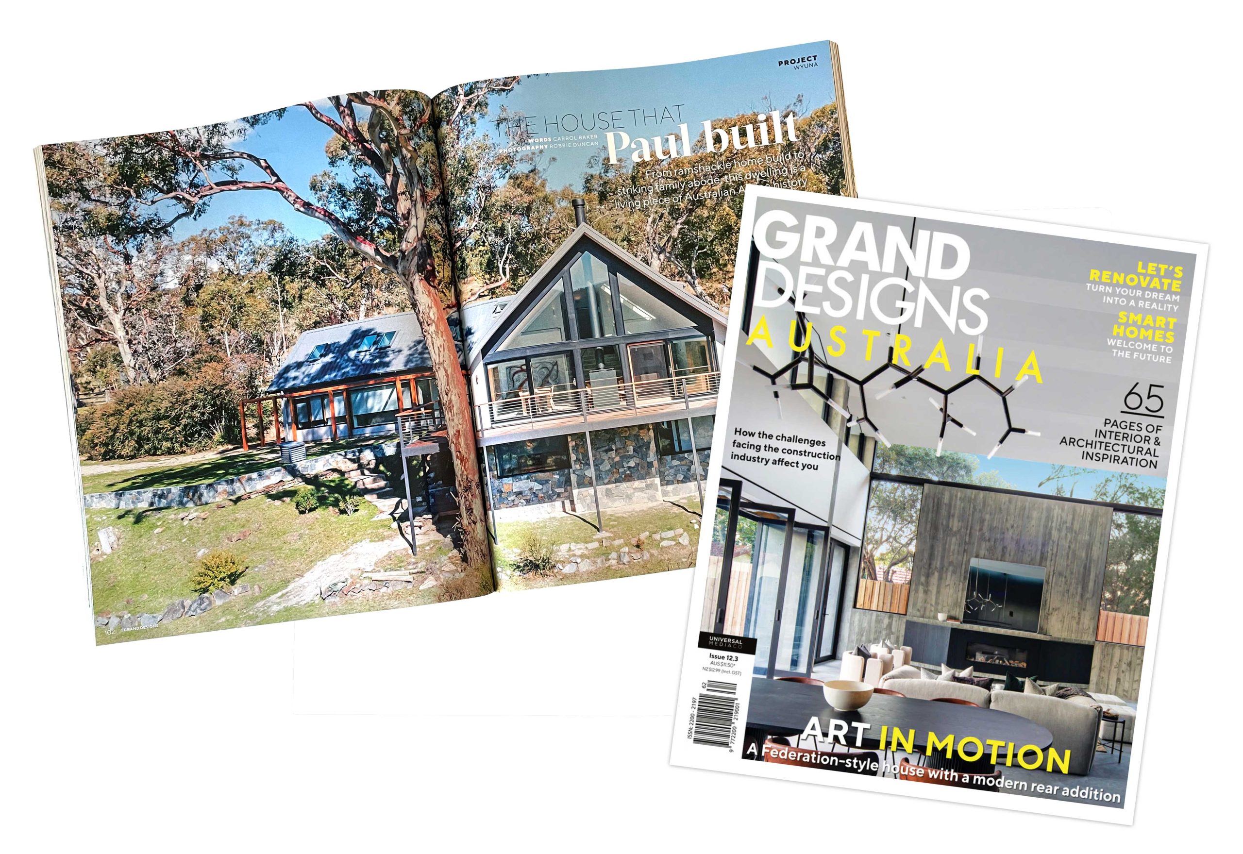 Grand Designs Australia magazine cover and opening spread featuring House Wyuna by Jindabyne Homes, showing the exterior of the alpine home surrounded by gum trees.